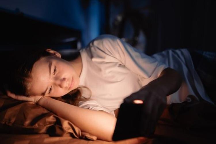 worried girl looking at her phone