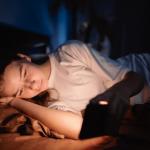 worried girl looking at her phone